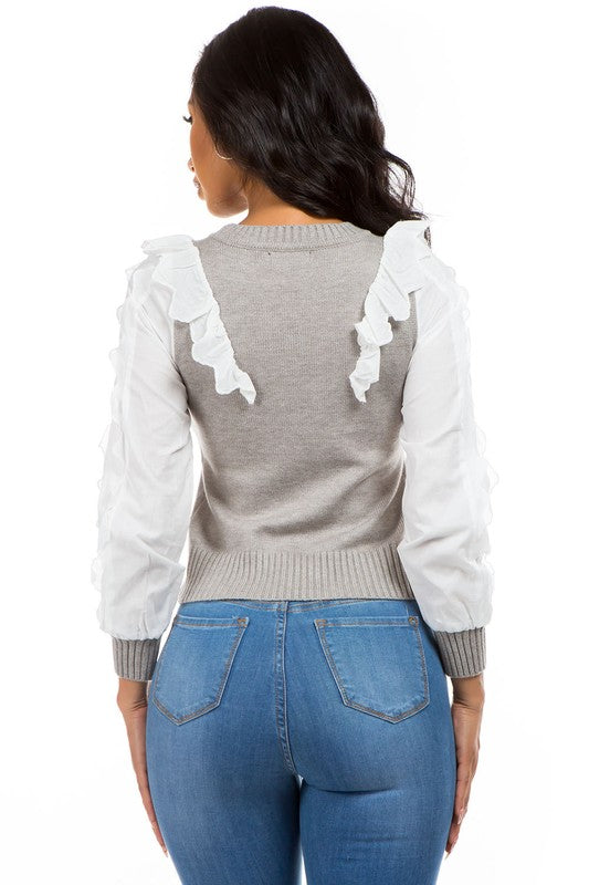 Sweater gris con vuelitos