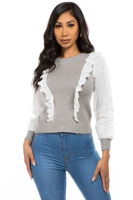 Sweater gris con vuelitos